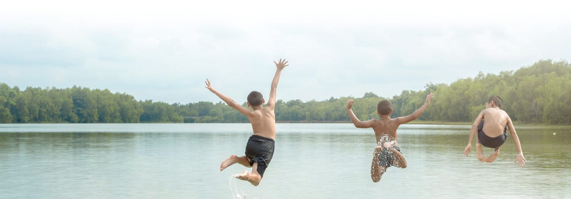 Kids Jumping in Lake